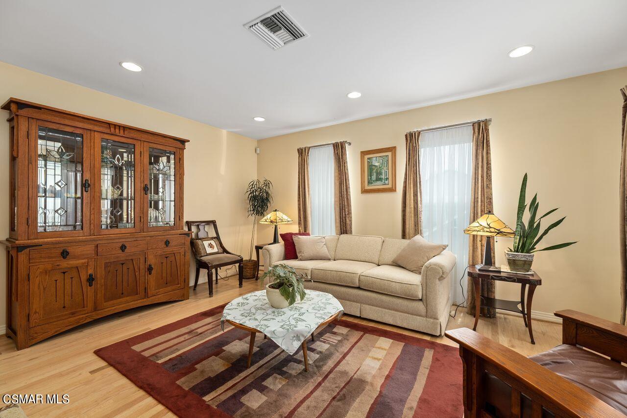 11616 Clarkson Road Los Angeles, CA 90064 - Photo 4 of 34 a living room with furniture and wooden floor