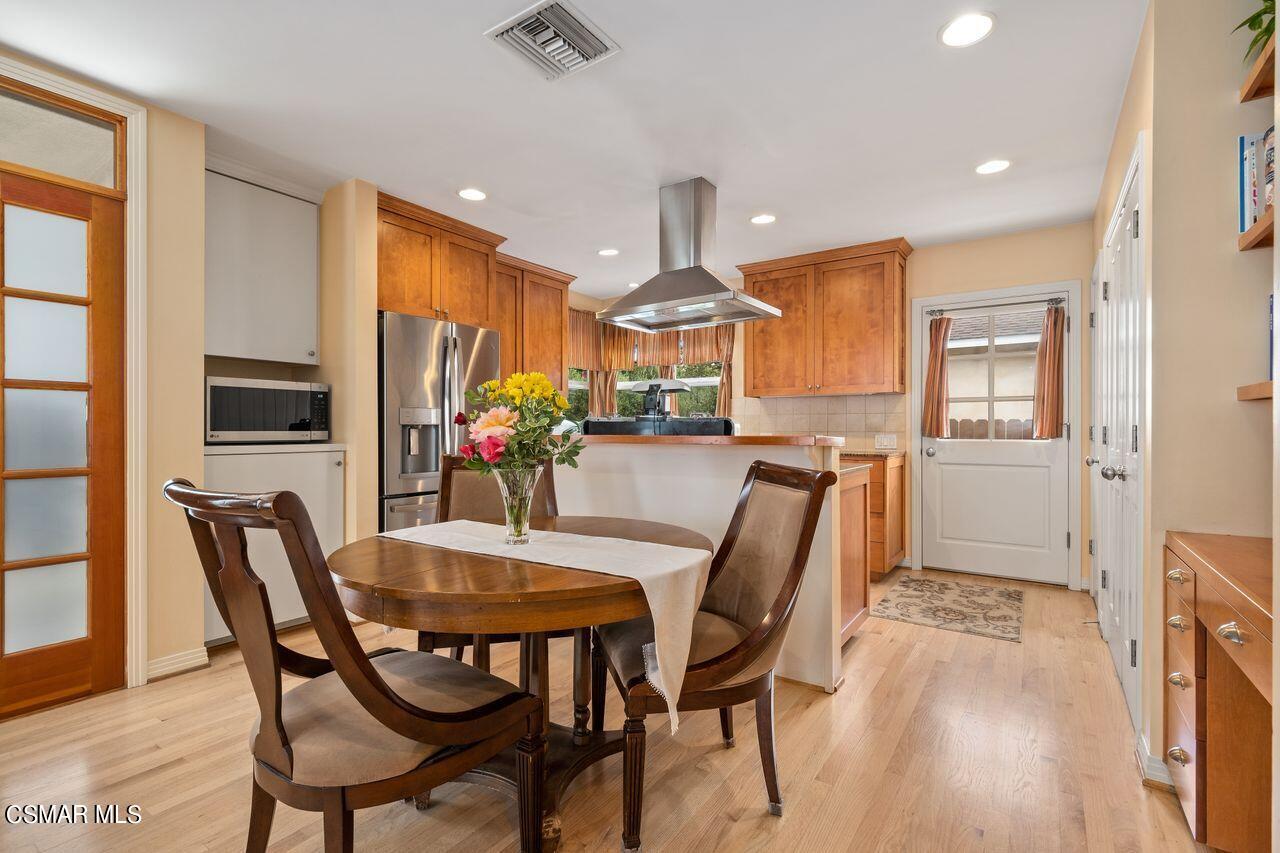 11616 Clarkson Road Los Angeles, CA 90064 - Photo 7 of 34 a view of a dining room with furniture and a chandelier