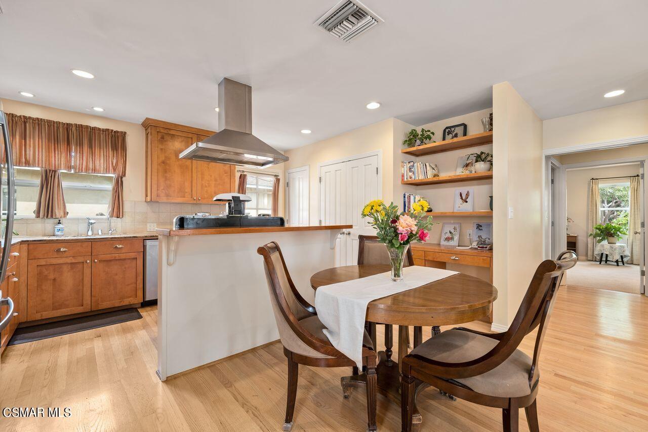 11616 Clarkson Road Los Angeles, CA 90064 - Photo 8 of 34 a view of a dining room with furniture and wooden floor