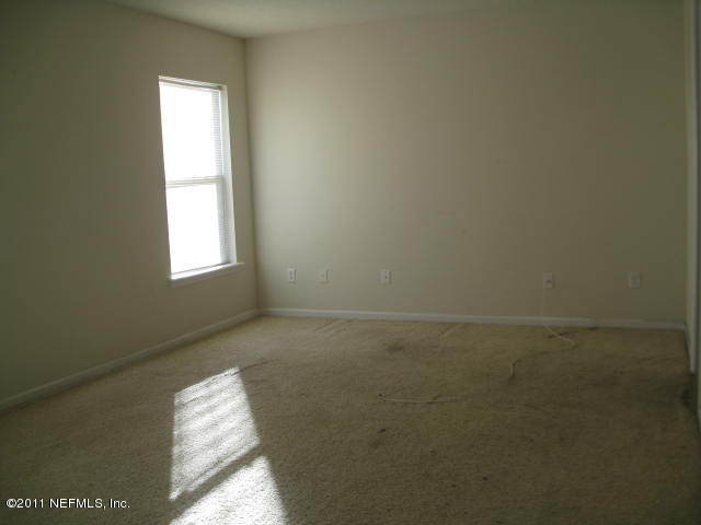 1108 Dawn Light Road Jacksonville, FL 32218 - Photo 8 of 19 a view of an empty room and window