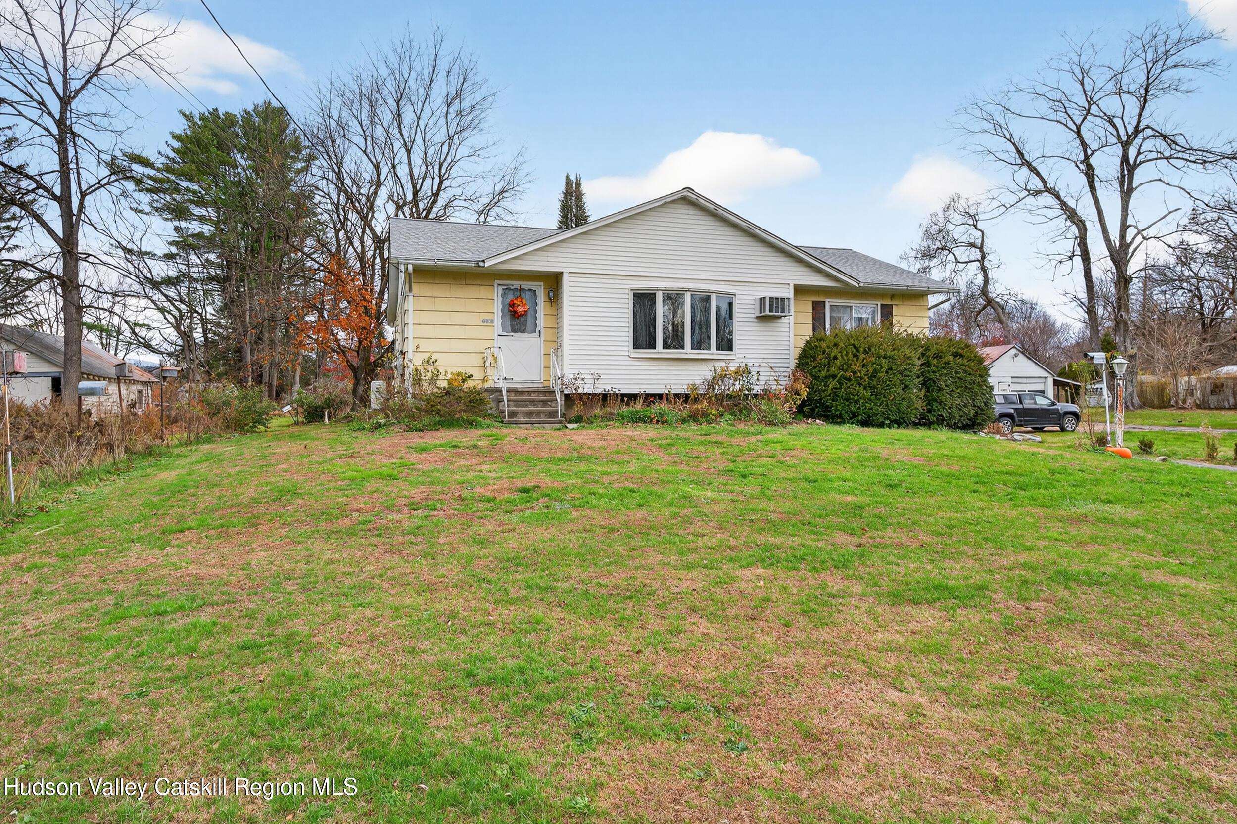 4030 Us Highway Stone Ridge, NY 12484 - Photo 1 of 22 a front view of a house with yard and green space