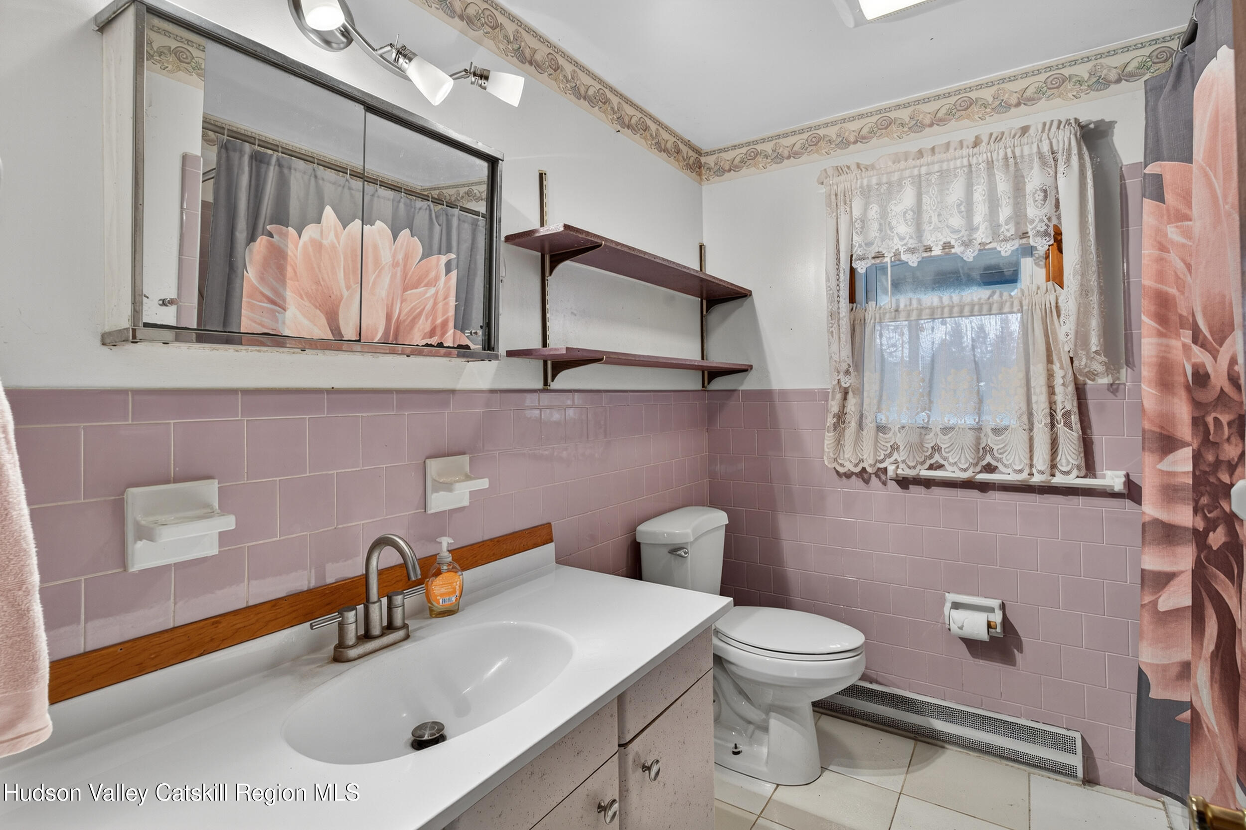 4030 Us Highway Stone Ridge, NY 12484 - Photo 17 of 22 a bathroom with a toilet sink and mirror