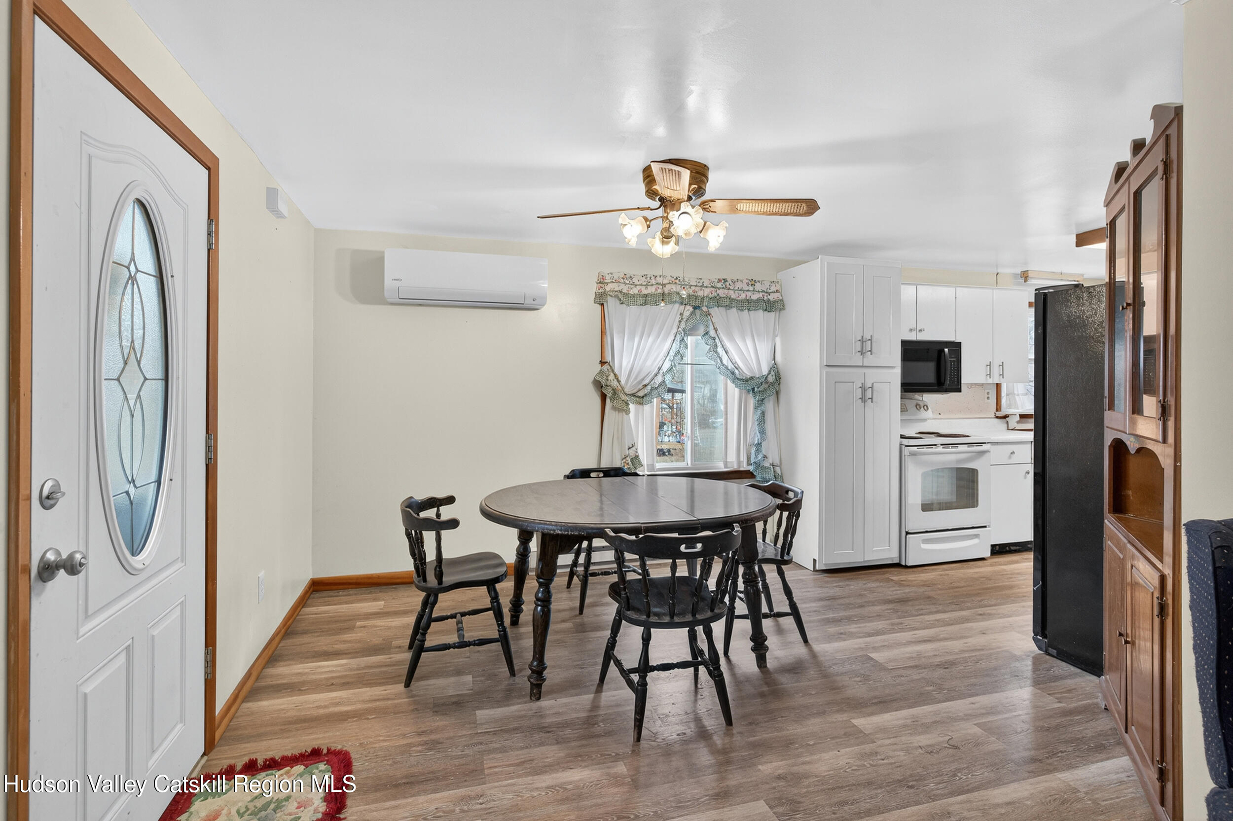 4030 Us Highway Stone Ridge, NY 12484 - Photo 6 of 22 a view of a dining room with furniture and wooden floor