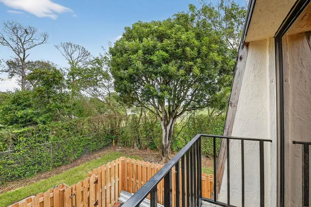 a view of balcony with small garden