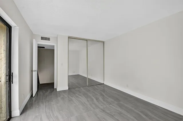 a view of a balcony with yard