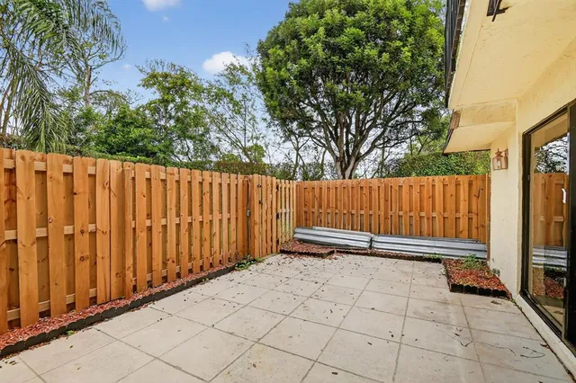 a view of outdoor space with wooden fence