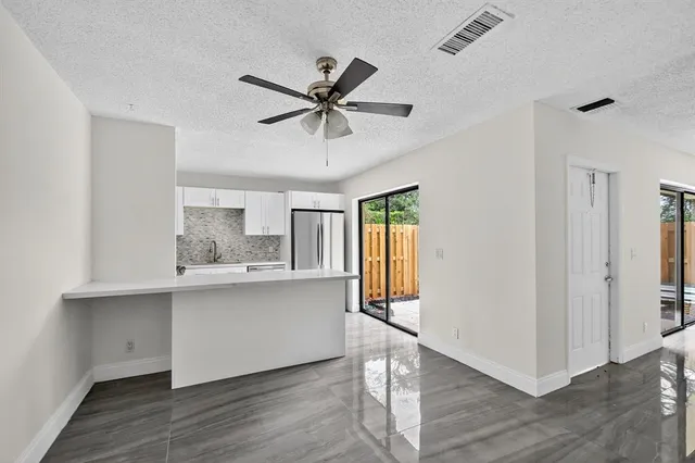 a view of cabinets and wooden floor