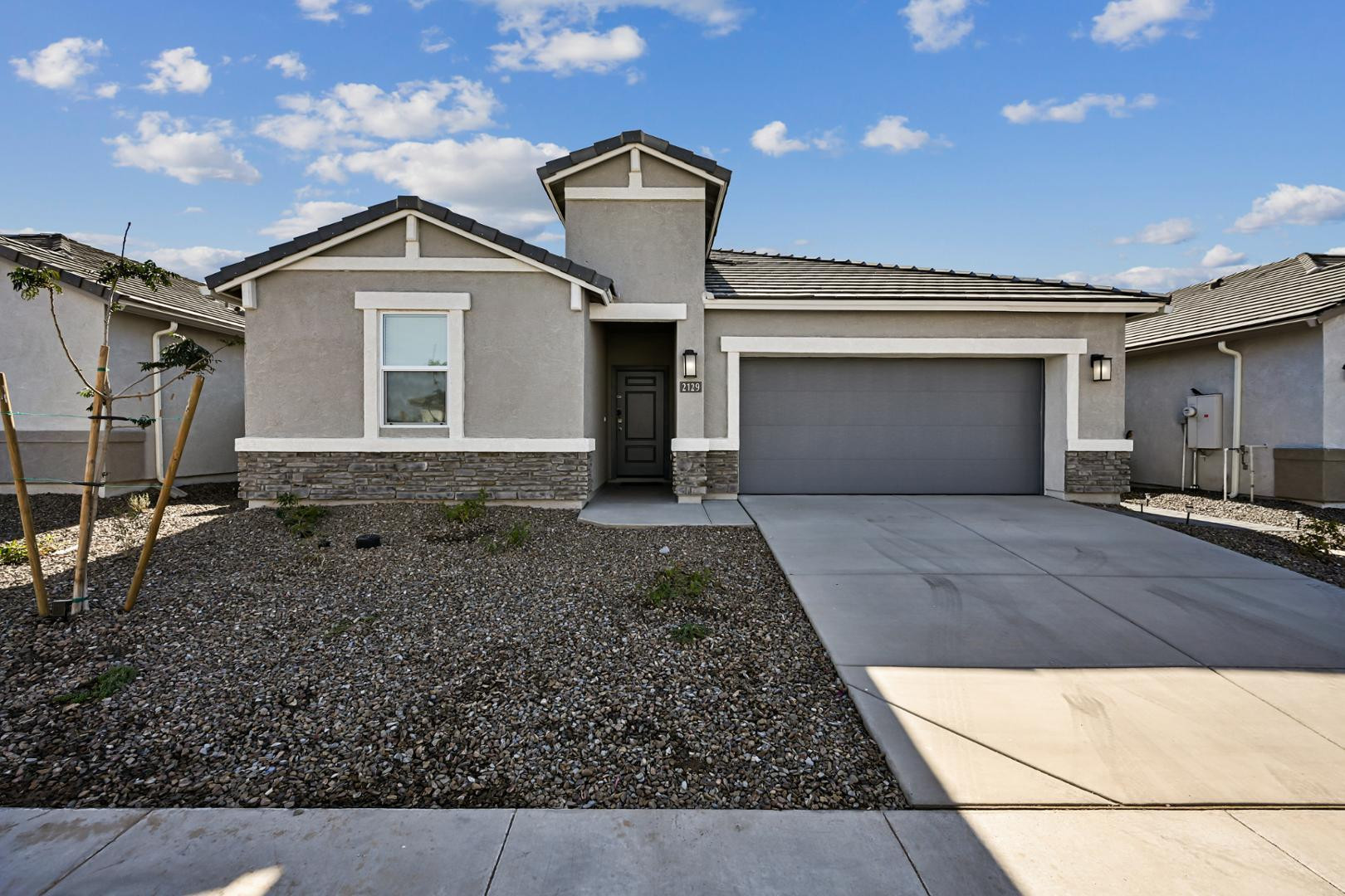 a front view of a house with a yard