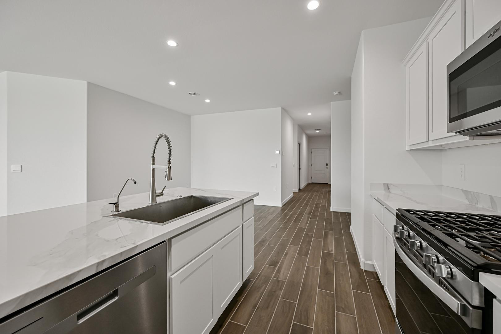 2129 West Spaulding Avenue Apache Junction, AZ 85120 - Photo 11 of 28 a kitchen with sink a stove and cabinets