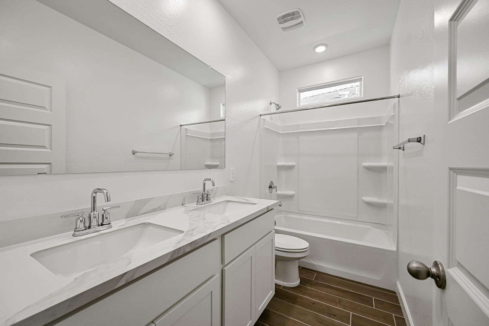 2129 West Spaulding Avenue Apache Junction, AZ 85120 - Photo 12 of 28 a bathroom with a granite countertop sink toilet and shower