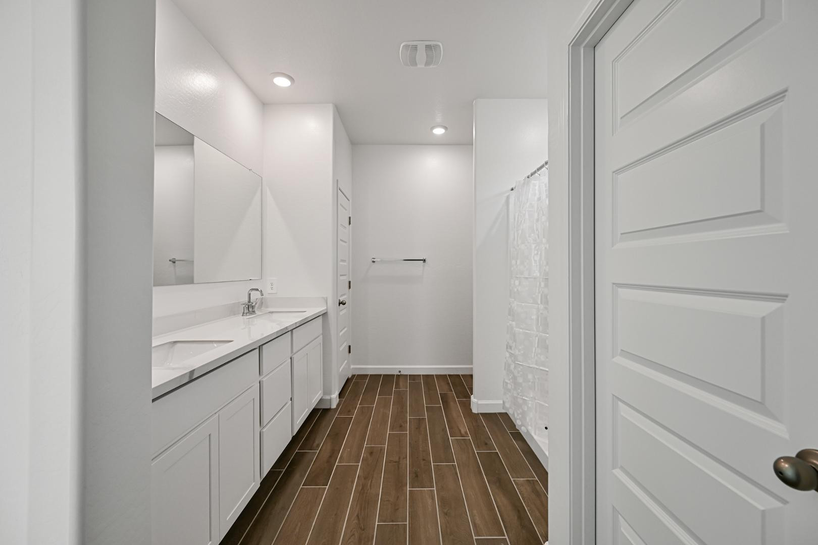 2129 West Spaulding Avenue Apache Junction, AZ 85120 - Photo 15 of 28 a bathroom with a sink a mirror and a shower