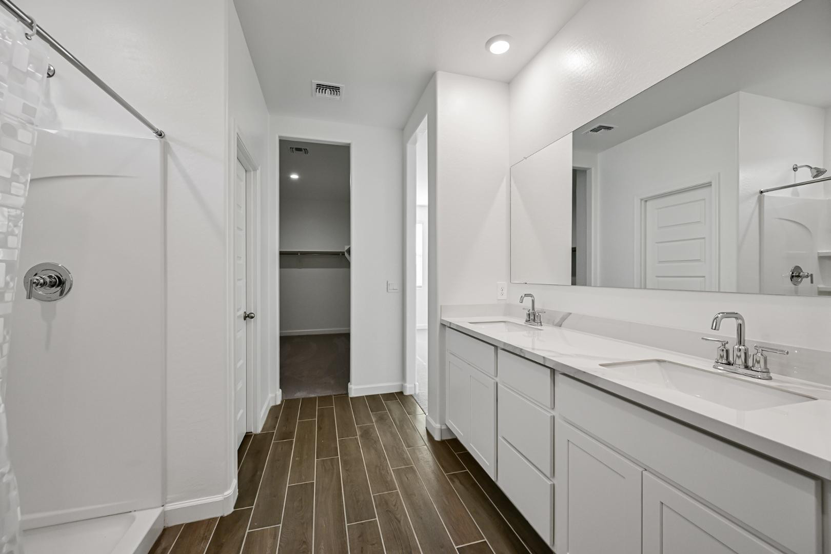 2129 West Spaulding Avenue Apache Junction, AZ 85120 - Photo 16 of 28 a spacious bathroom with a double vanity sink and mirror