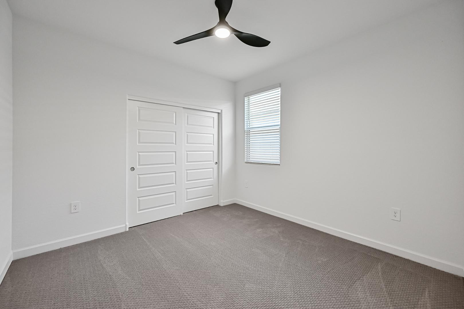 2129 West Spaulding Avenue Apache Junction, AZ 85120 - Photo 19 of 28 a view of an empty room with a window