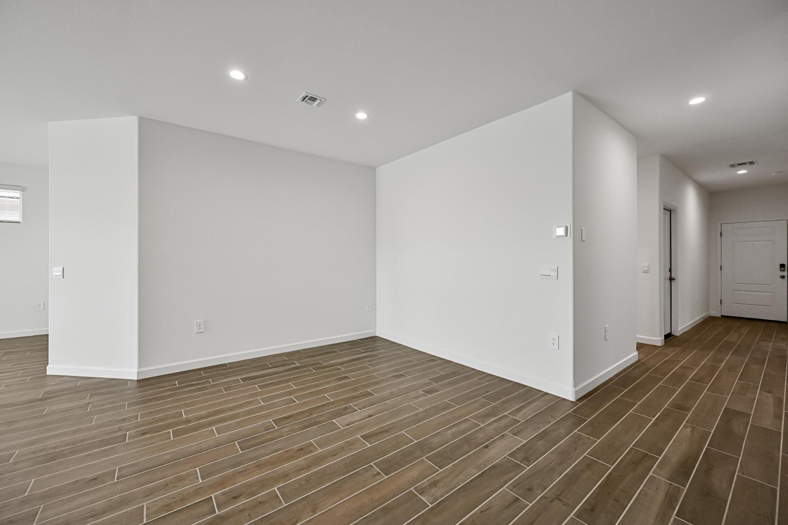 2129 West Spaulding Avenue Apache Junction, AZ 85120 - Photo 20 of 28 a view of an empty room with wooden floor