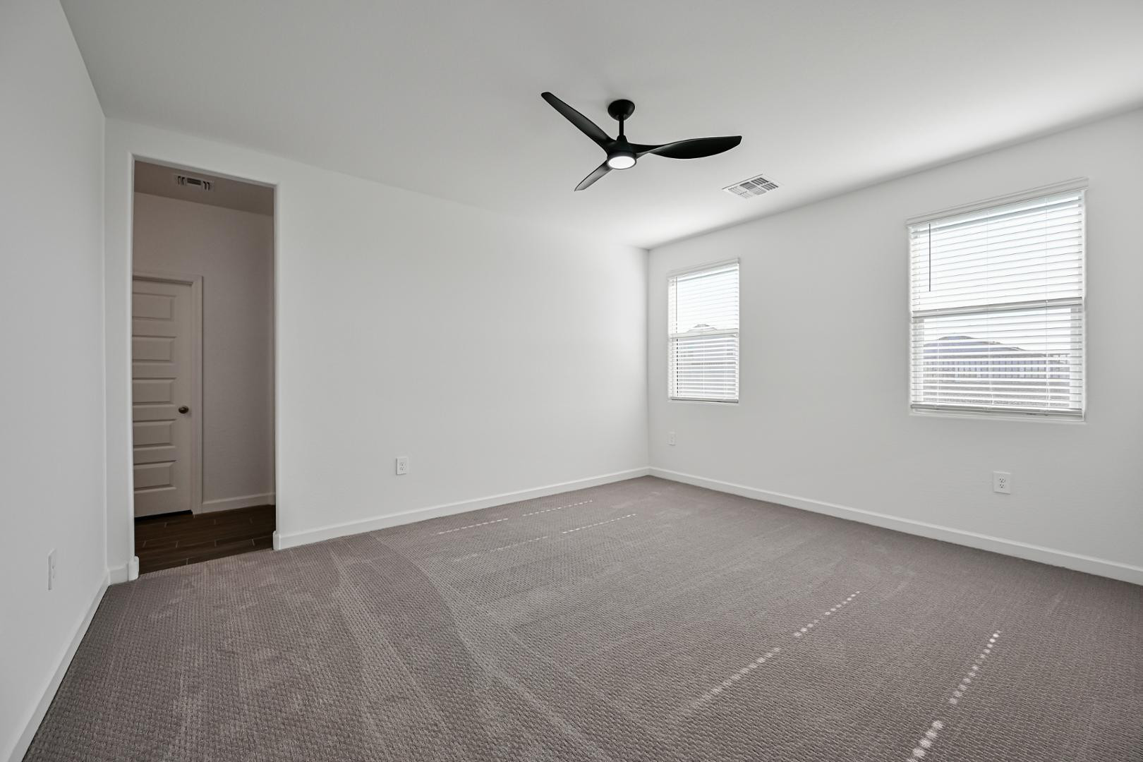 2129 West Spaulding Avenue Apache Junction, AZ 85120 - Photo 24 of 28 a view of an empty room with a window