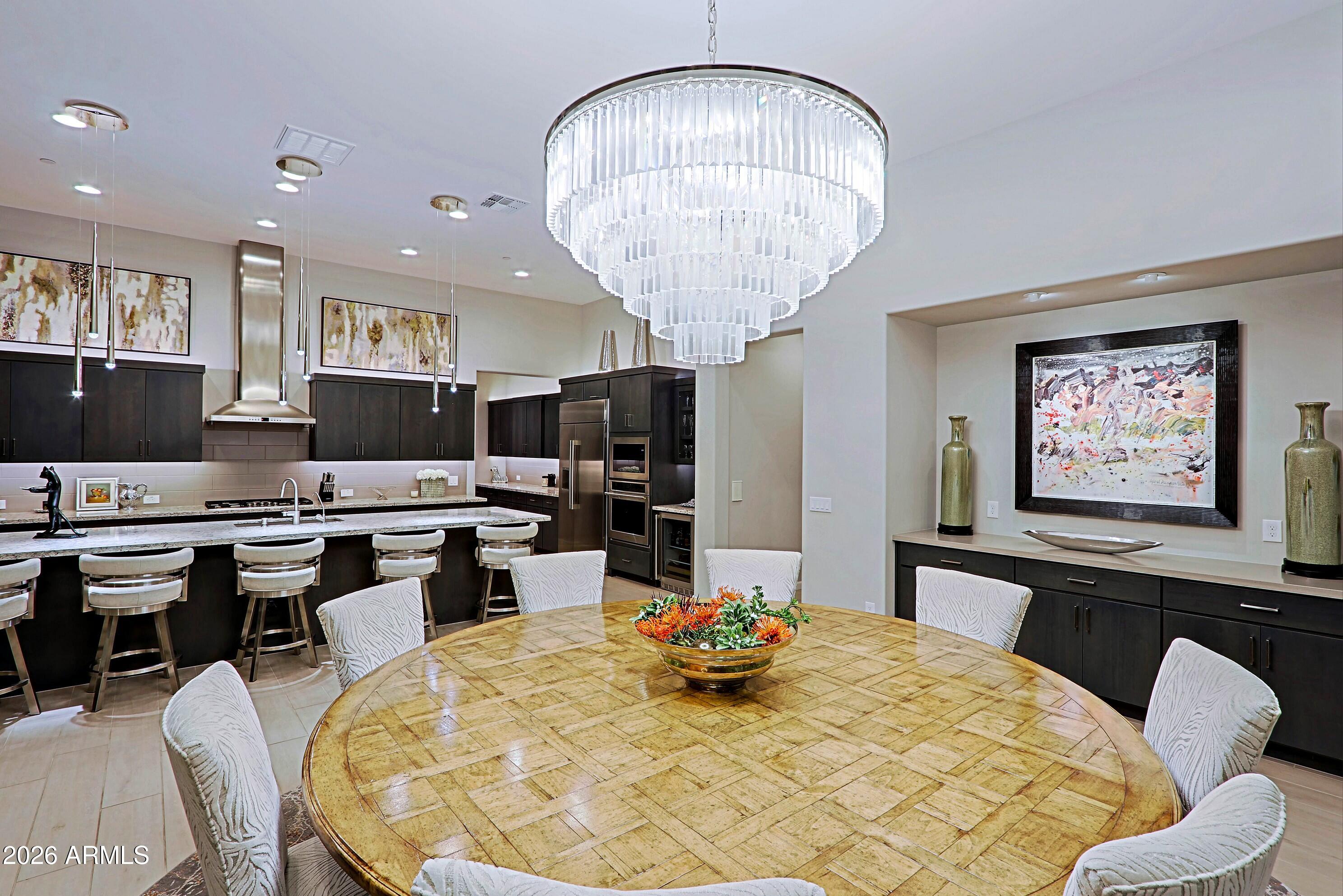 17864 East Paria Canyon Drive Rio Verde, AZ 85263 - Photo 12 of 66 a kitchen with a table and chairs in it