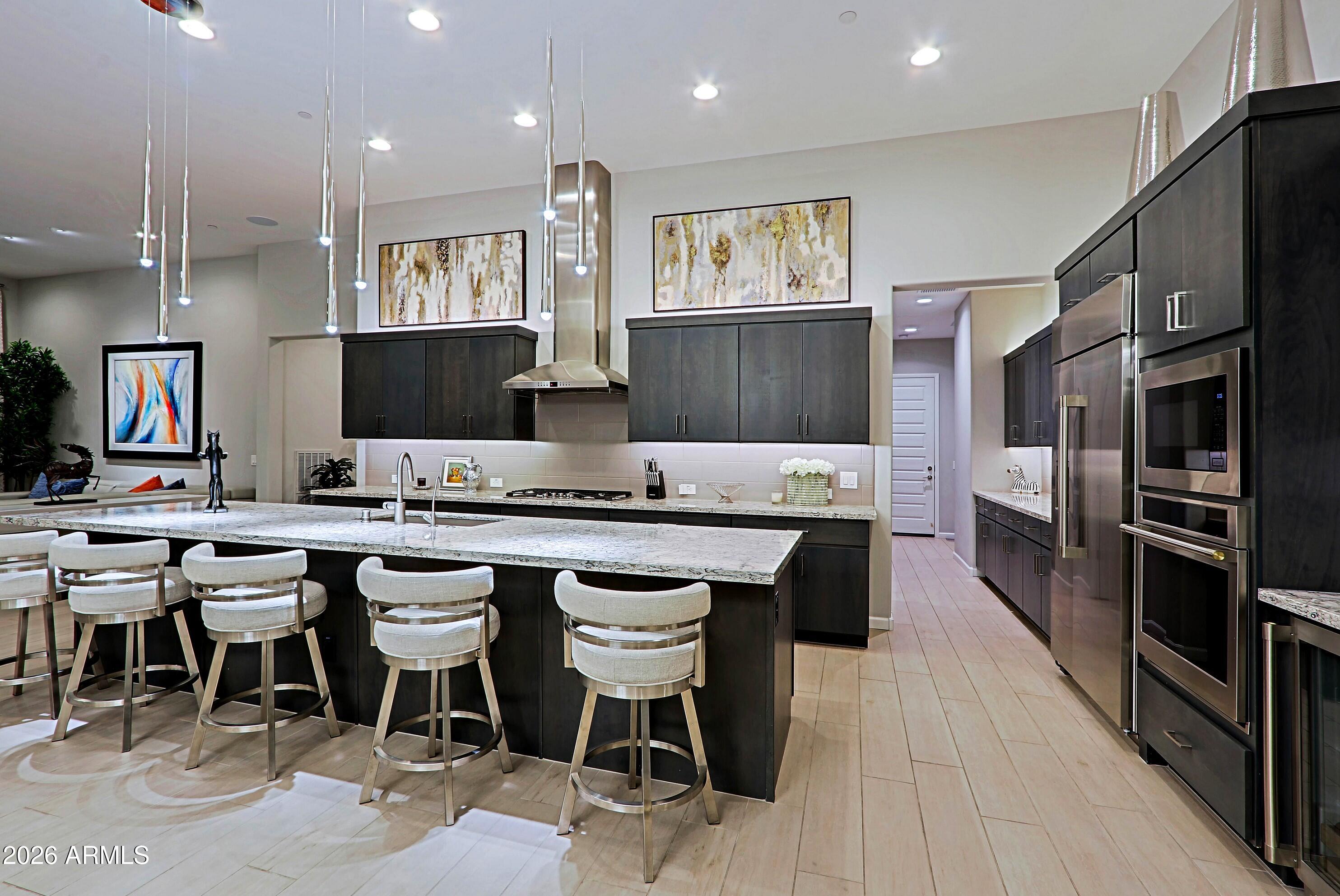 17864 East Paria Canyon Drive Rio Verde, AZ 85263 - Photo 17 of 66 a large kitchen with a table and chairs in it