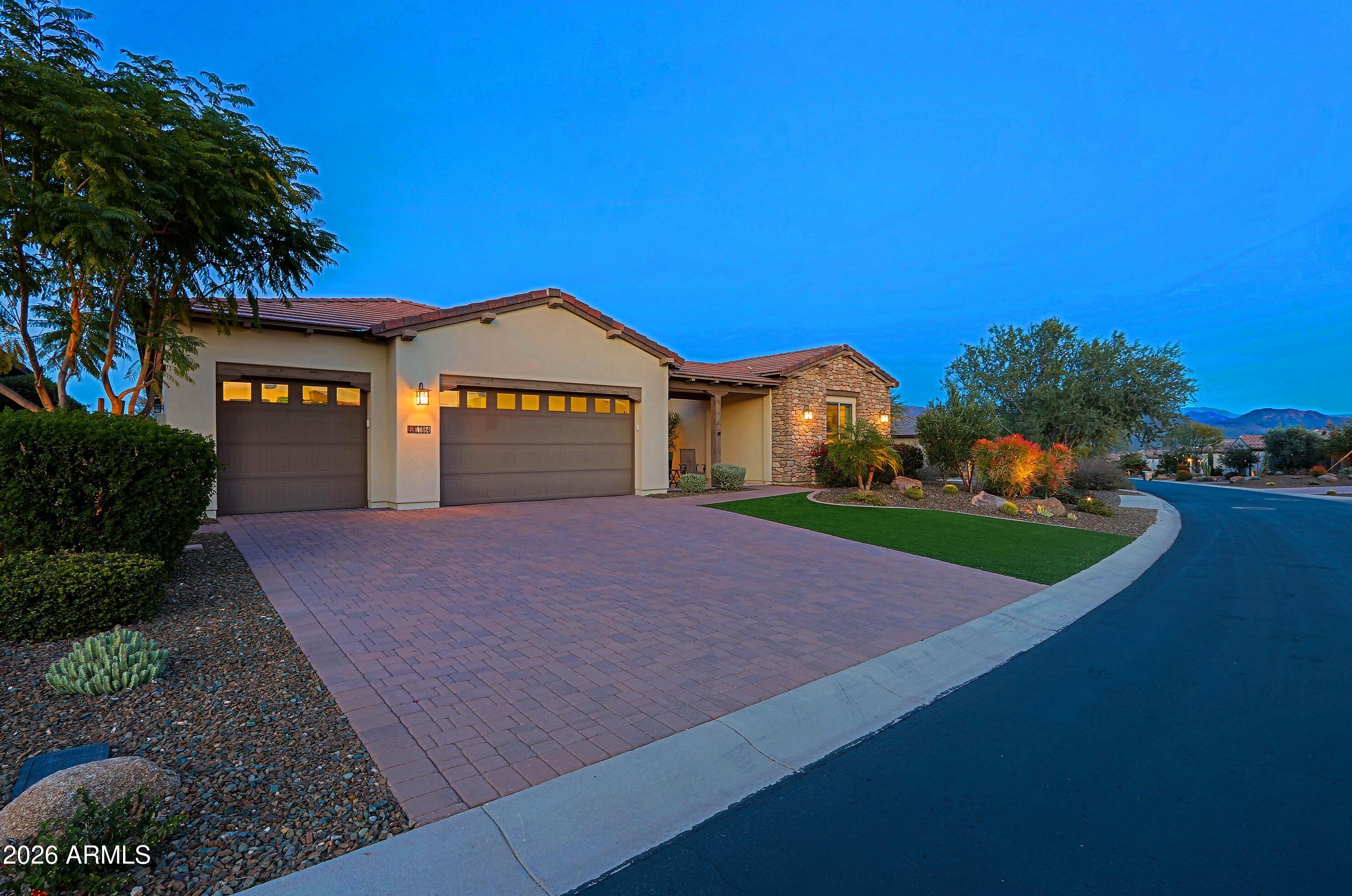 17864 East Paria Canyon Drive Rio Verde, AZ 85263 - Photo 2 of 66 a front view of a house with a yard and garage
