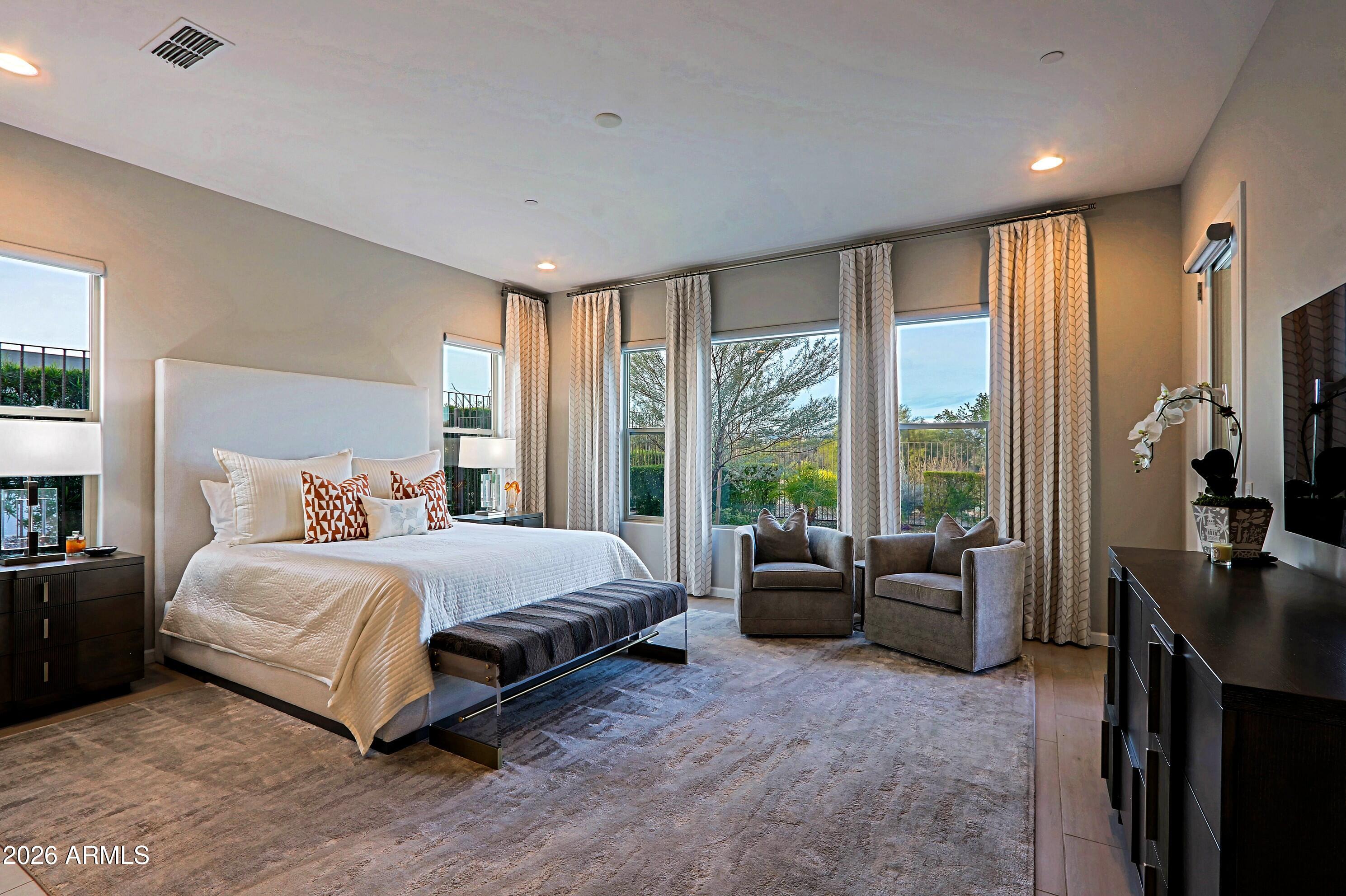 17864 East Paria Canyon Drive Rio Verde, AZ 85263 - Photo 21 of 66 a spacious bedroom with a bed and glass window