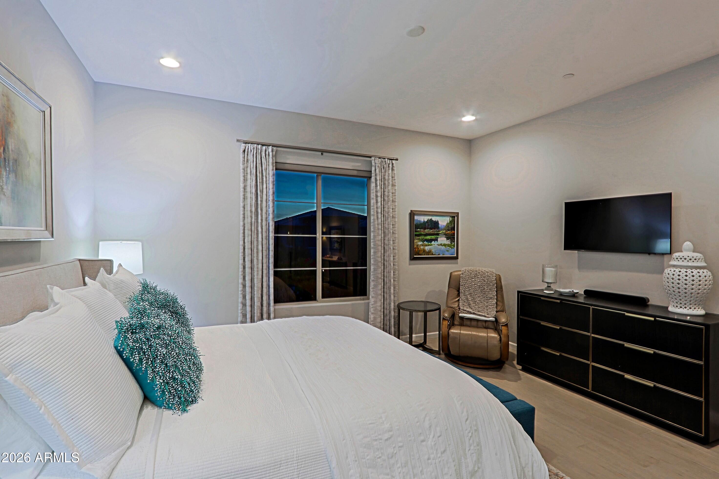 17864 East Paria Canyon Drive Rio Verde, AZ 85263 - Photo 31 of 66 a bedroom with a bed and a television