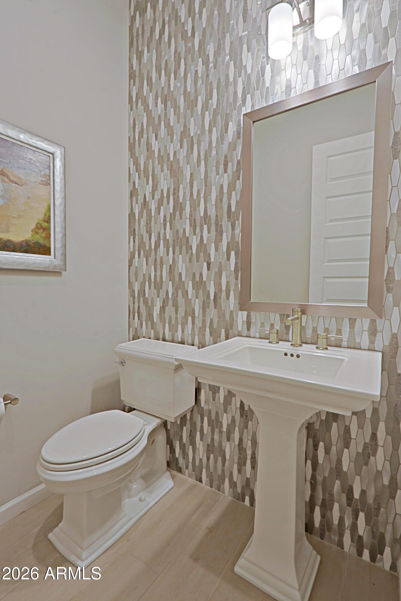 17864 East Paria Canyon Drive Rio Verde, AZ 85263 - Photo 36 of 66 a bathroom with a toilet sink and mirror