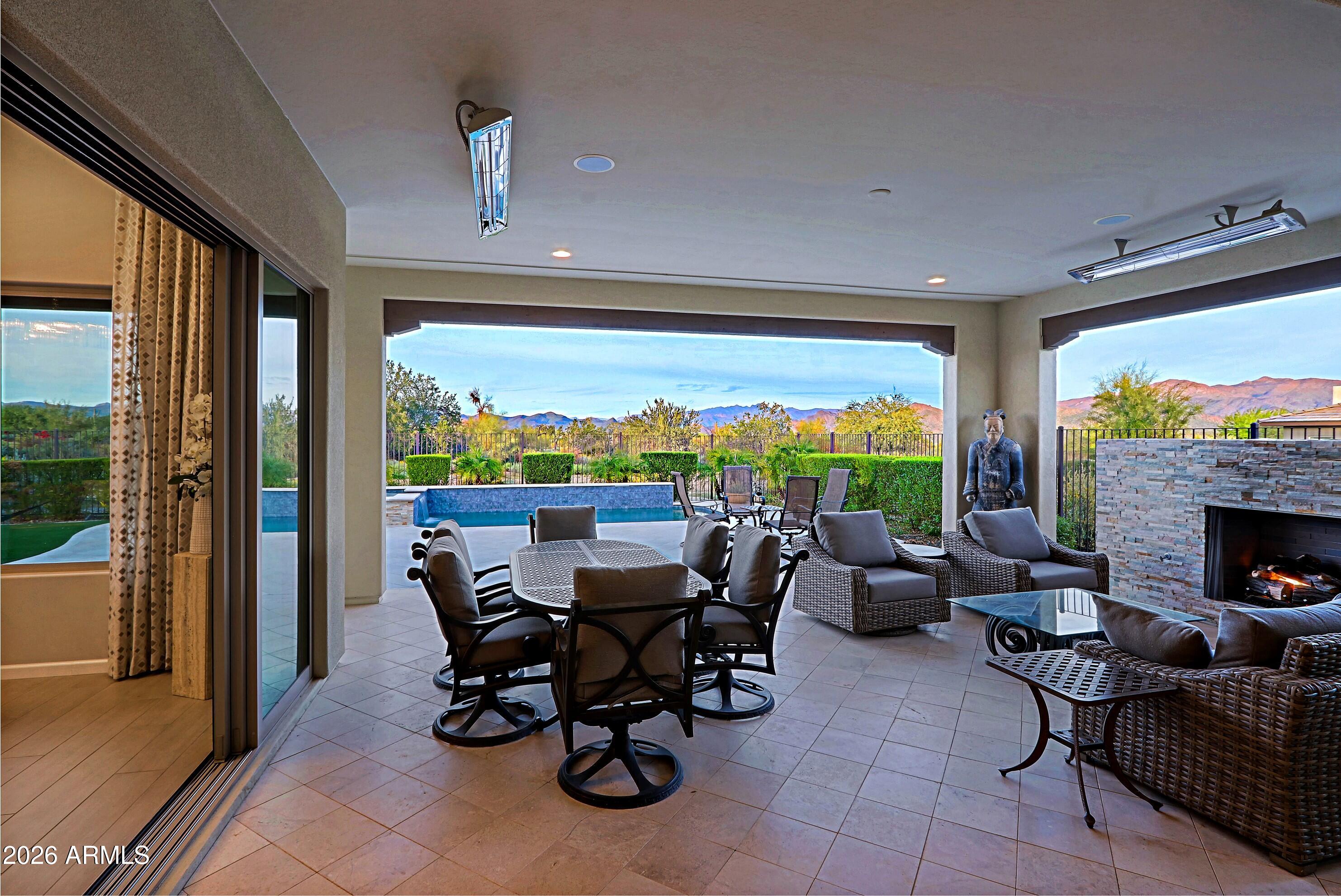 17864 East Paria Canyon Drive Rio Verde, AZ 85263 - Photo 37 of 66 a living room with fireplace furniture and a large window