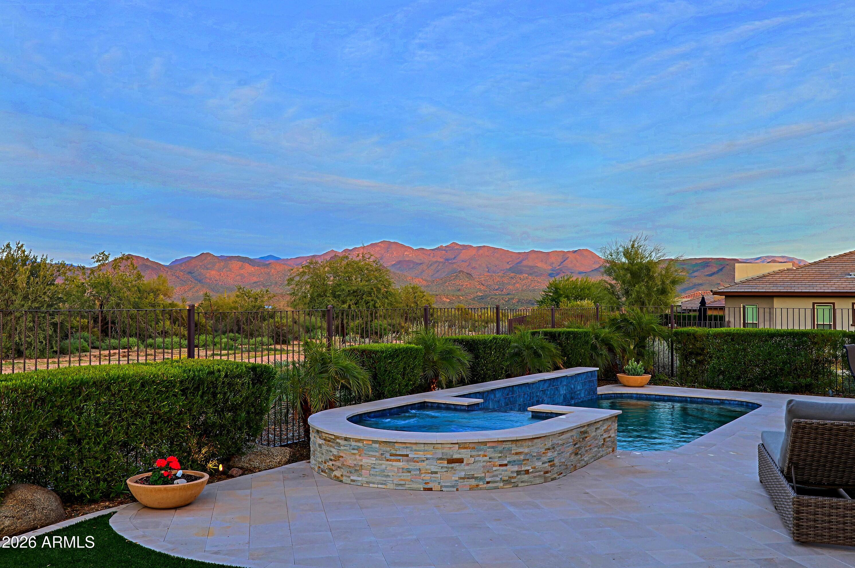 17864 East Paria Canyon Drive Rio Verde, AZ 85263 - Photo 39 of 66 a view of a table and chairs in the garden