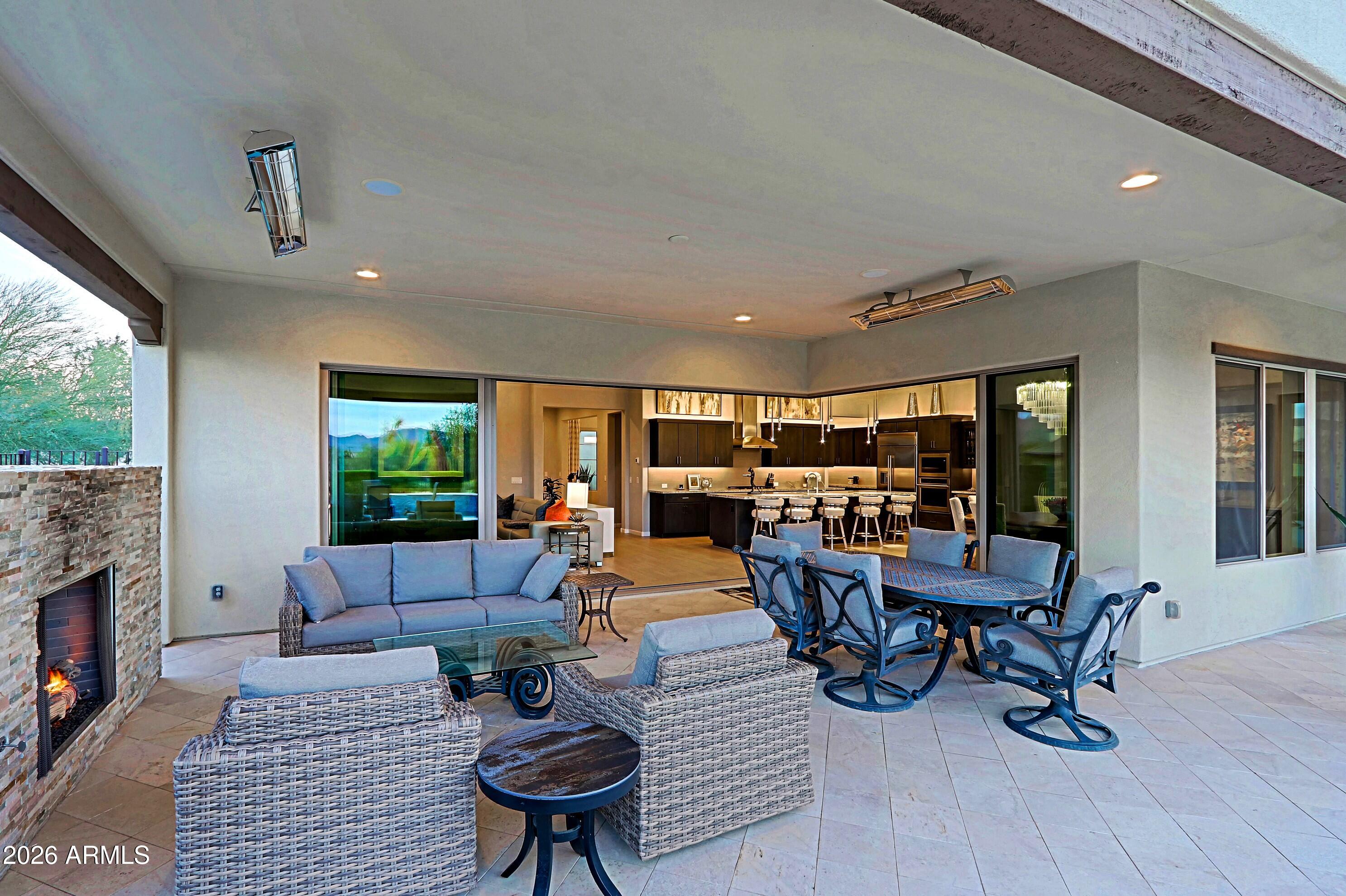 17864 East Paria Canyon Drive Rio Verde, AZ 85263 - Photo 44 of 66 a living room with fireplace furniture and a large window