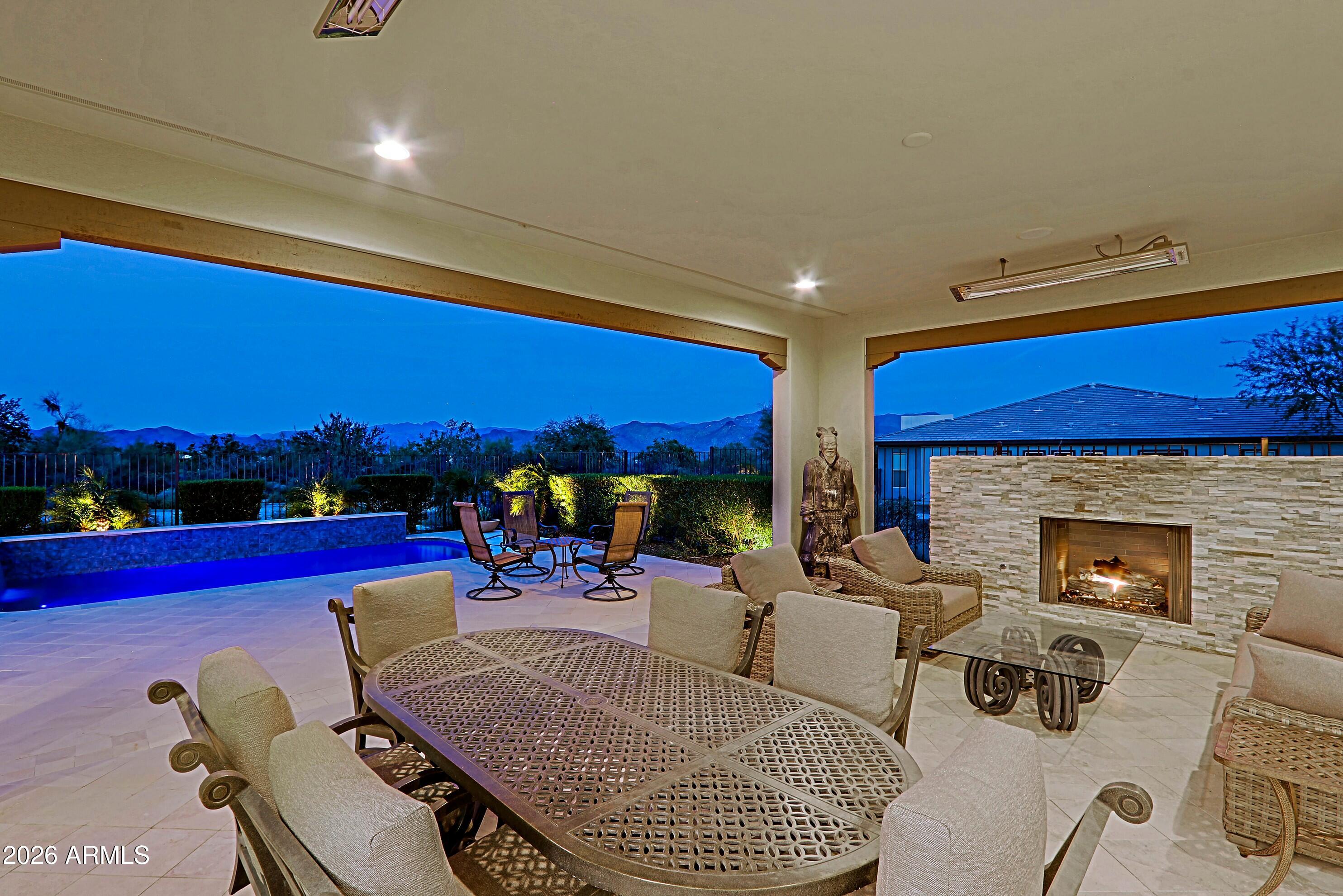 17864 East Paria Canyon Drive Rio Verde, AZ 85263 - Photo 46 of 66 a living room with furniture a rug and a fireplace