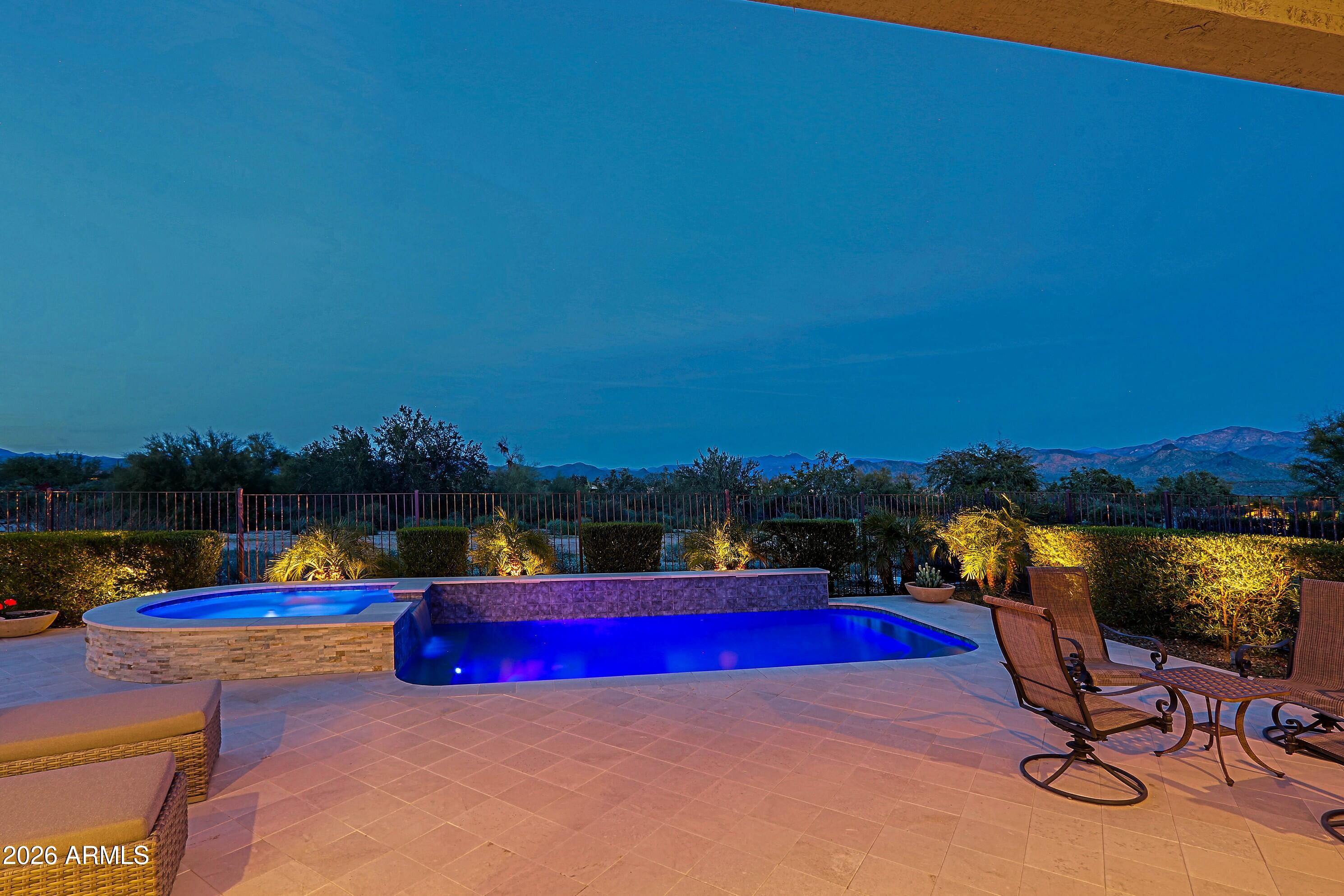 17864 East Paria Canyon Drive Rio Verde, AZ 85263 - Photo 47 of 66 a view of swimming pool with a table and chairs