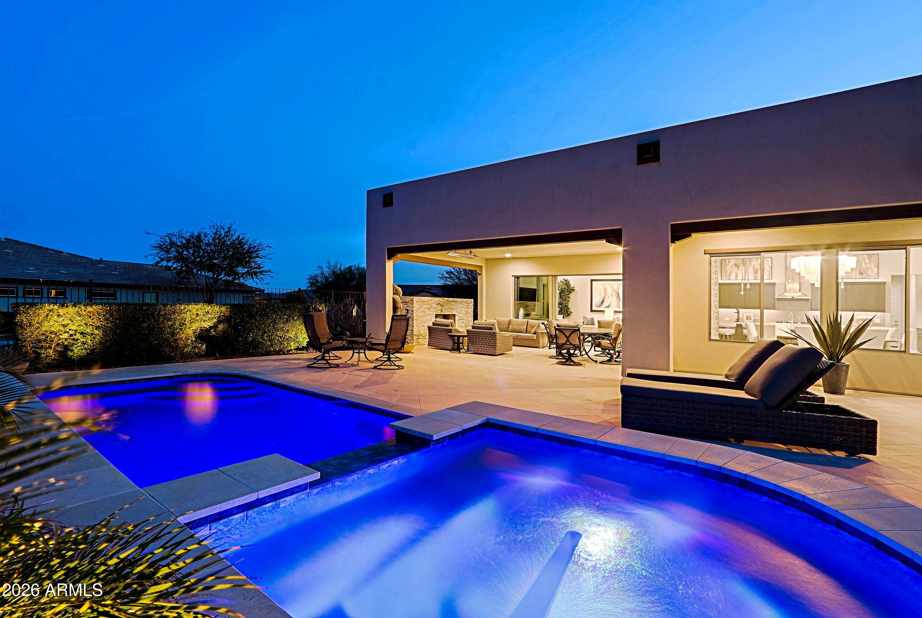 17864 East Paria Canyon Drive Rio Verde, AZ 85263 - Photo 49 of 66 a kitchen with stainless steel appliances dining table and chairs