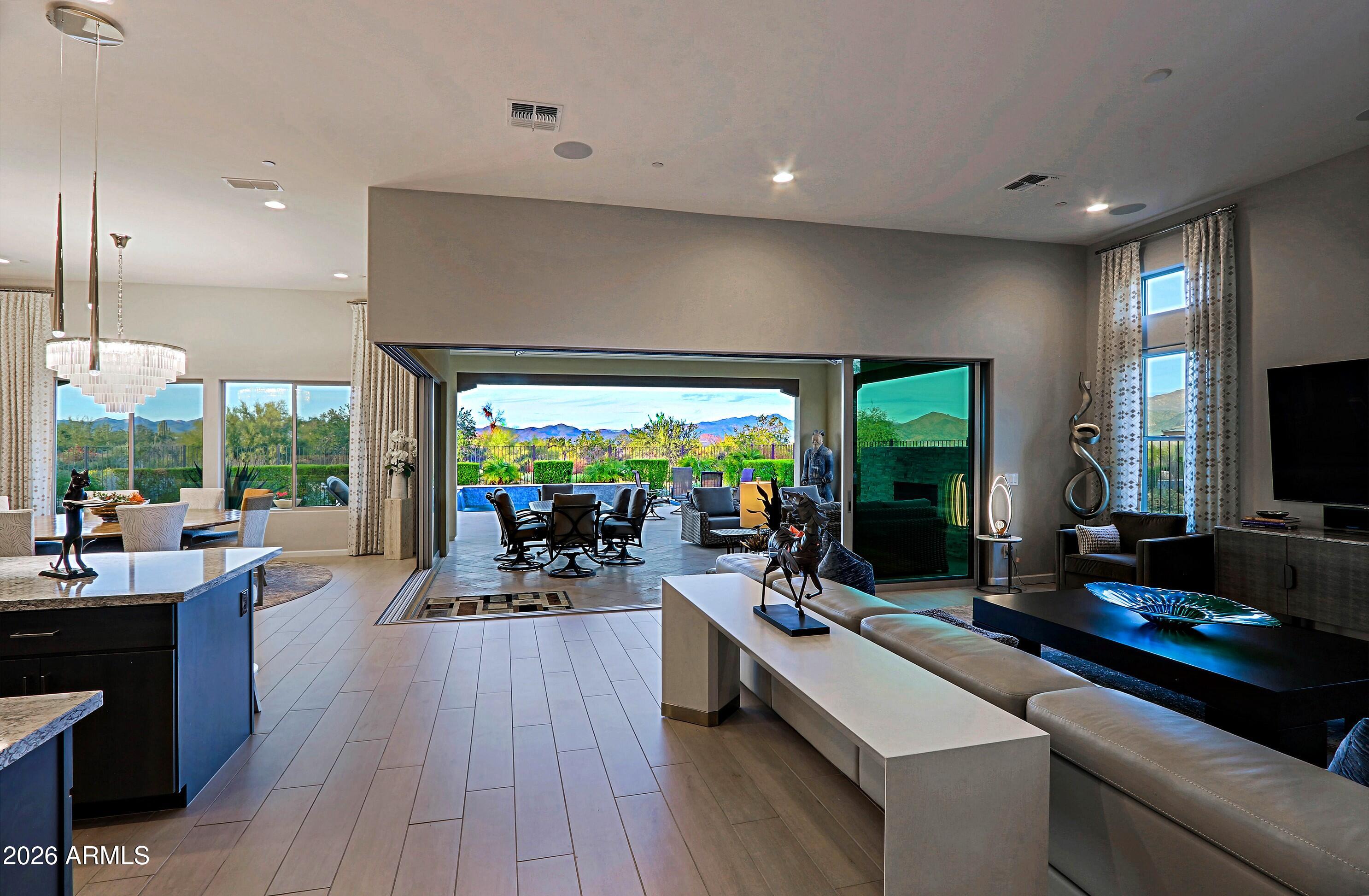 17864 East Paria Canyon Drive Rio Verde, AZ 85263 - Photo 6 of 66 a view of a room with gym equipment and a large window