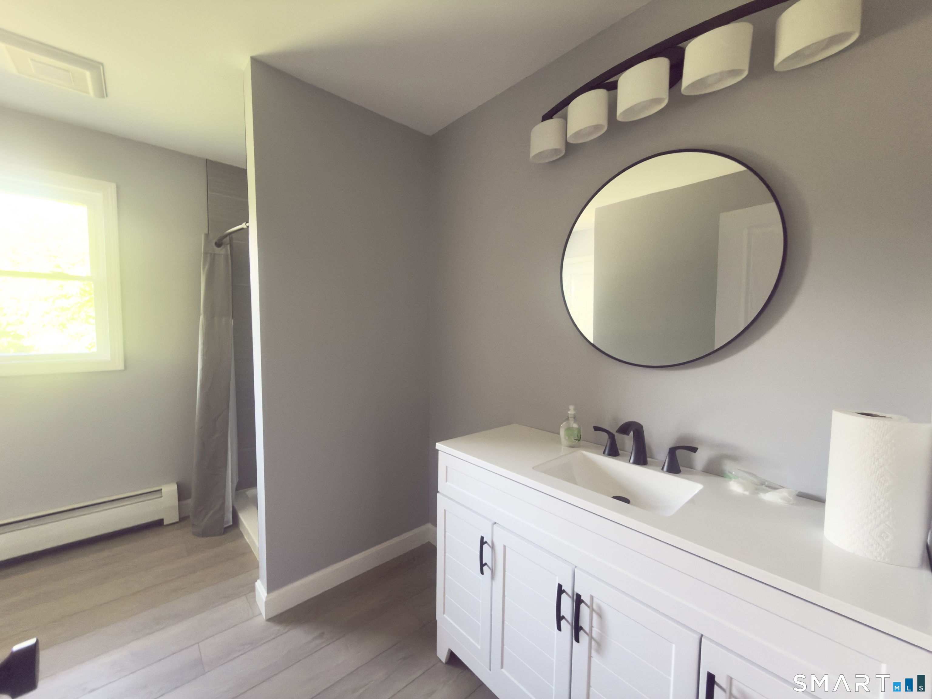 44 Polly Avenue Killingly, CT 06239 - Photo 19 of 22 a bathroom with a sink and a mirror