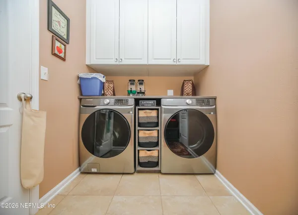 a utility room with dryer and washer