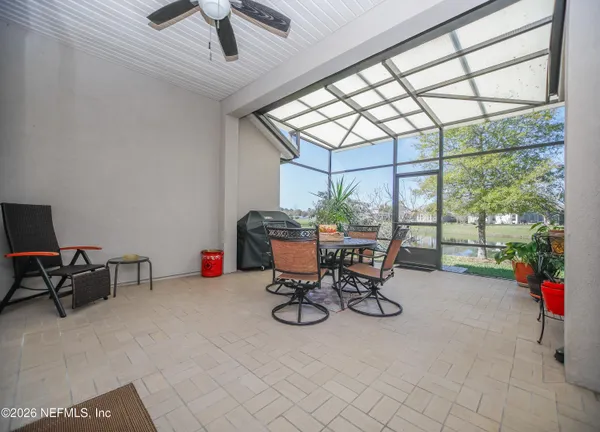 a view of a livingroom with furniture and a window