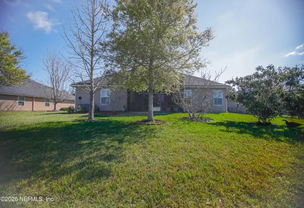 a view of a house with a back yard