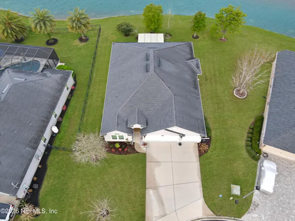 an aerial view of a house with a garden