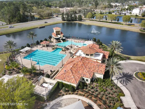 an aerial view of a house with a lake view