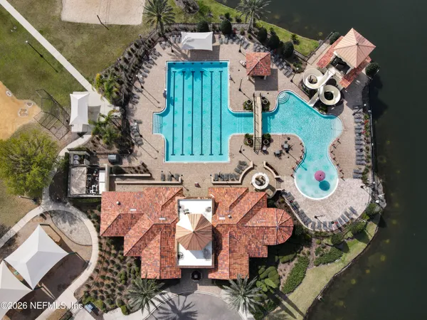 an aerial view of a house with a swimming pool