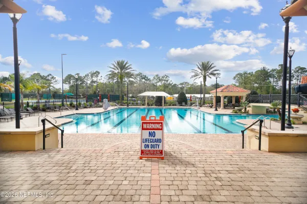 a swimming pool with outdoor seating