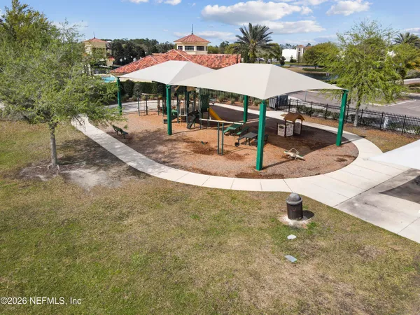 a view of a swimming pool and an outdoor seating