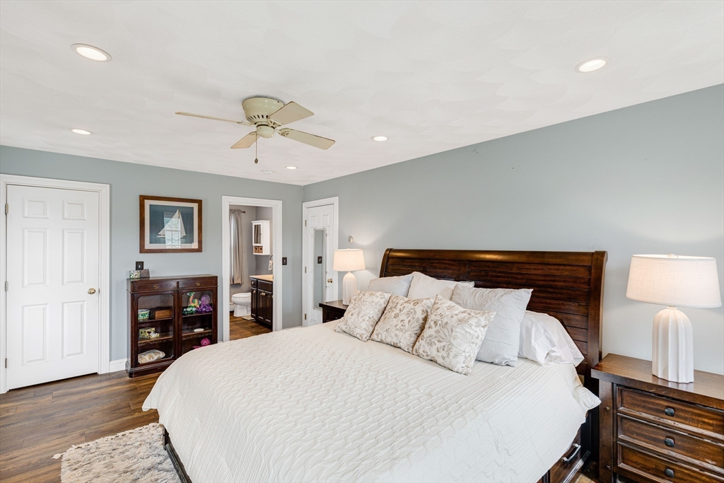 54 Old Merrill Street Amesbury, MA 01913 - Photo 19 of 34 a bedroom with a bed and wooden floor
