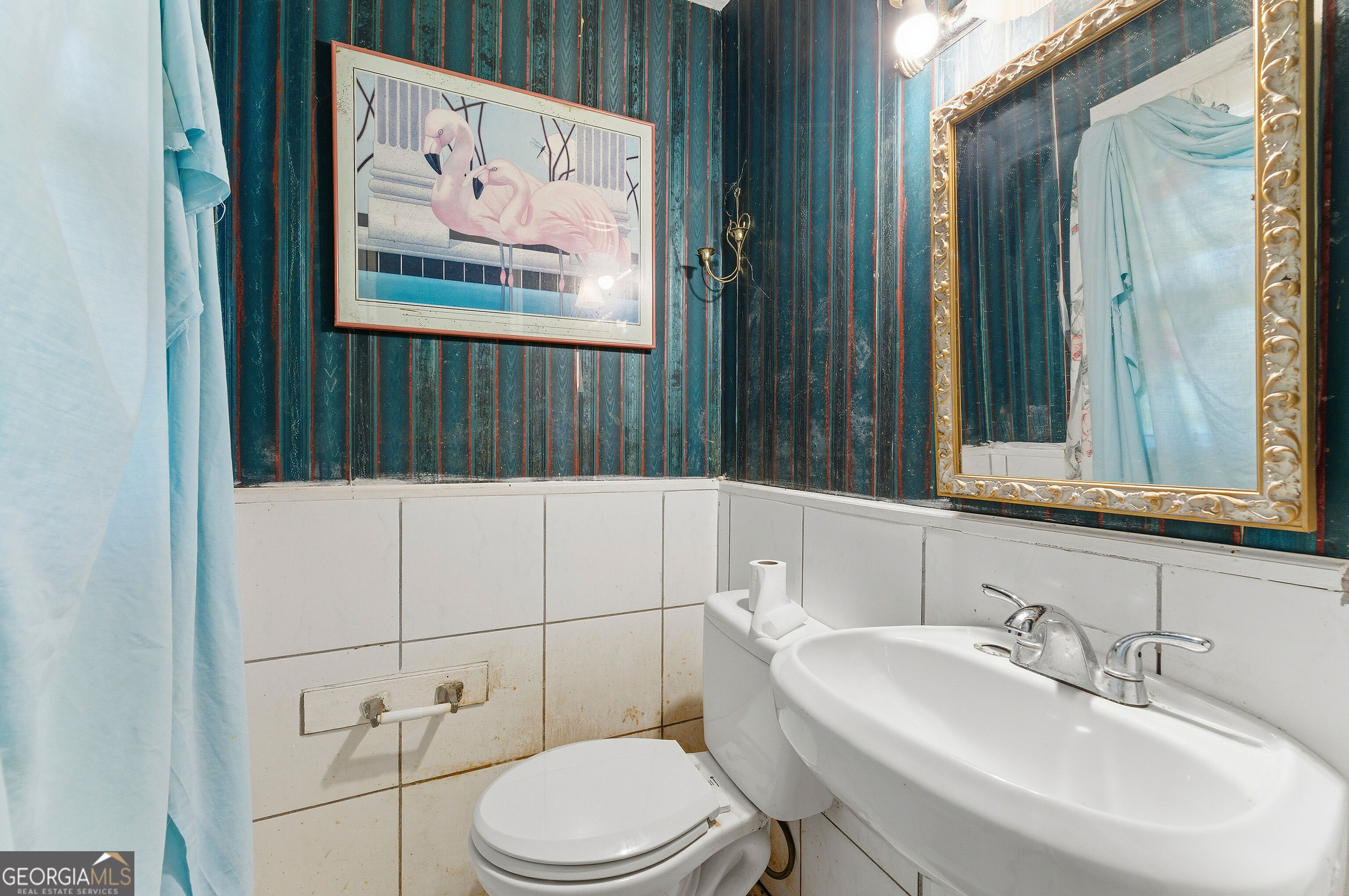 2848 Gresham Rd S East Atlanta, GA 30316 - Photo 9 of 20 a bathroom with a toilet a sink and mirror