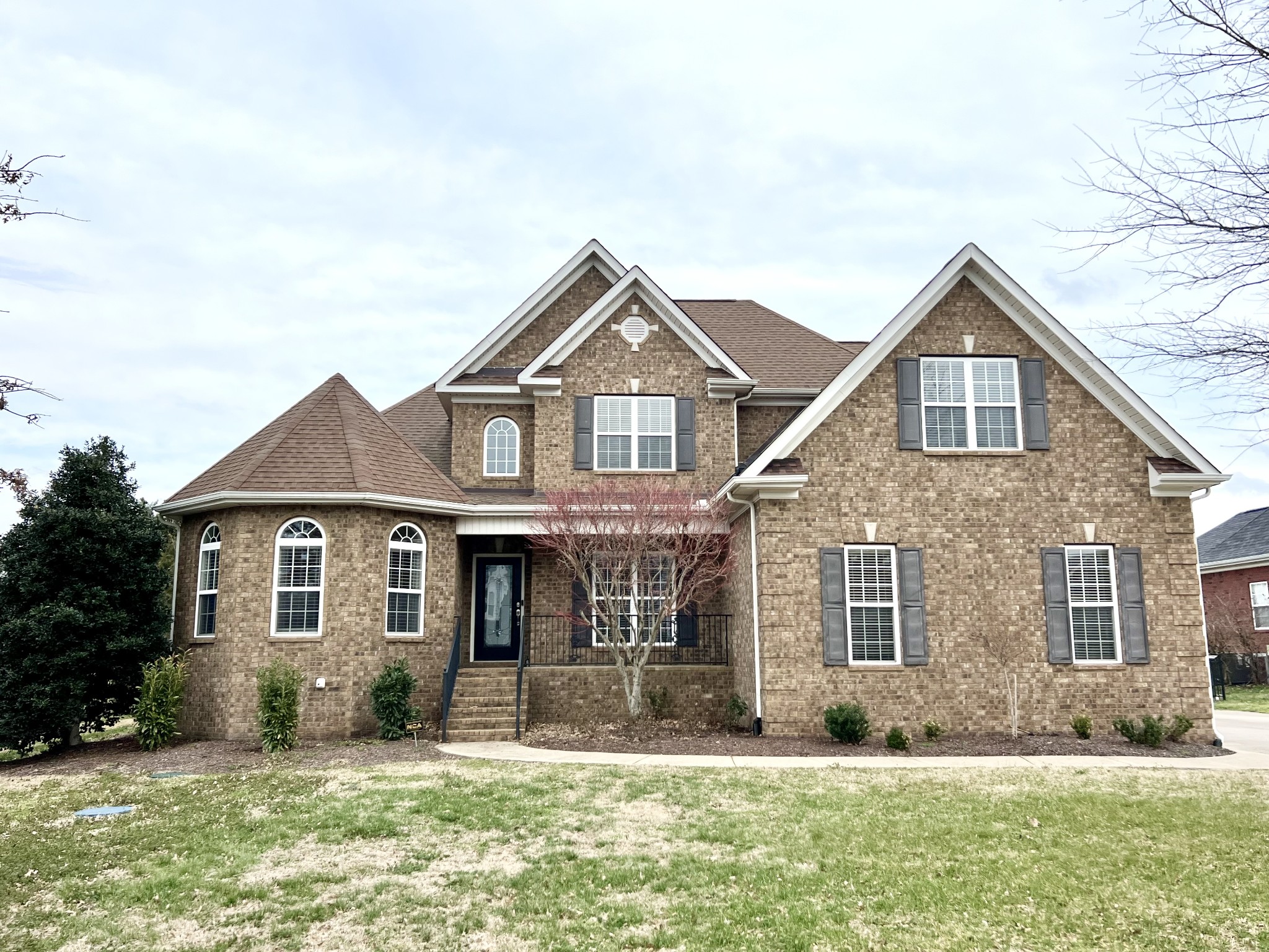 front view of a house with a yard