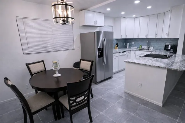 a bedroom with a bed and wall painting