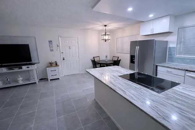 a bedroom with a bed and a wall painting