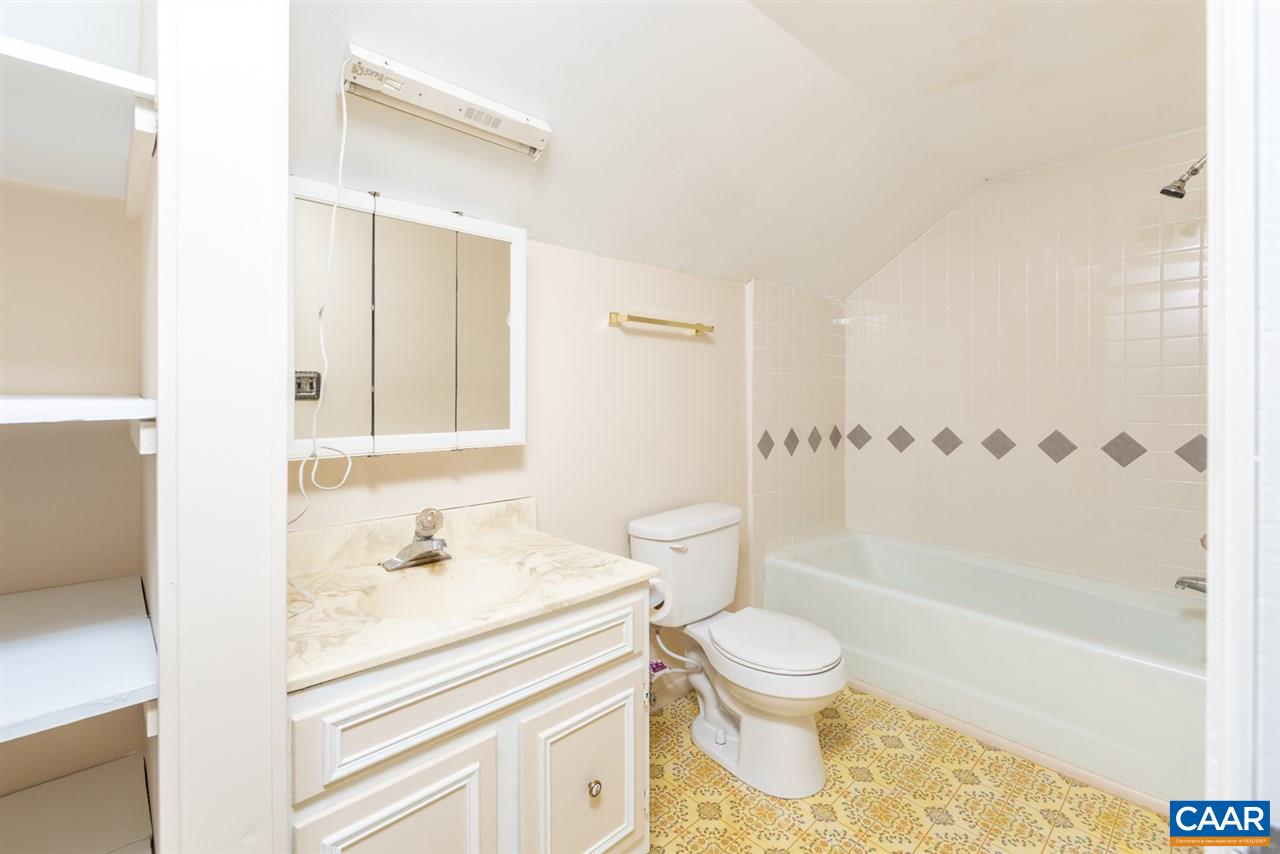 53 McKamy Springs Road Middlebrook, VA 24459 - Photo 23 of 46 a bathroom with a granite countertop sink a toilet and a bathtub