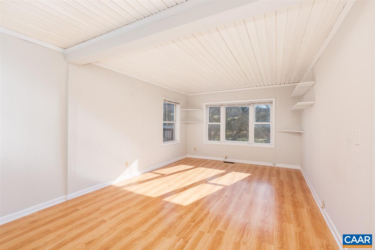 53 McKamy Springs Road Middlebrook, VA 24459 - Photo 4 of 46 a view of an empty room with a window and wooden floor