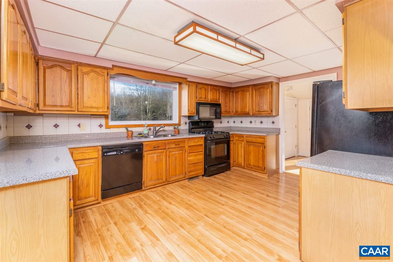 53 McKamy Springs Road Middlebrook, VA 24459 - Photo 8 of 46 a kitchen with stainless steel appliances granite countertop a sink a stove and a refrigerator