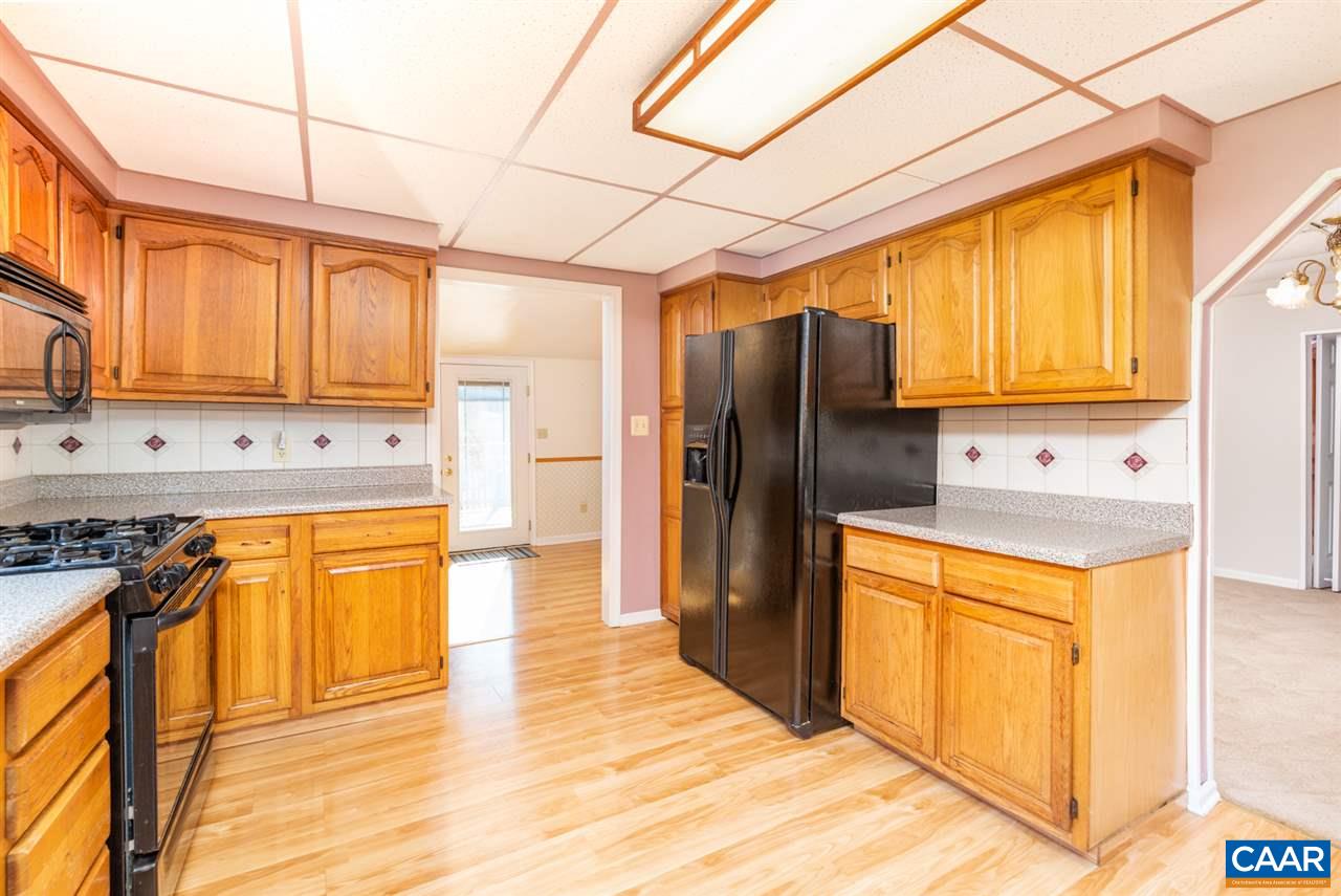 53 McKamy Springs Road Middlebrook, VA 24459 - Photo 9 of 46 a kitchen with stainless steel appliances granite countertop a refrigerator and a stove top oven
